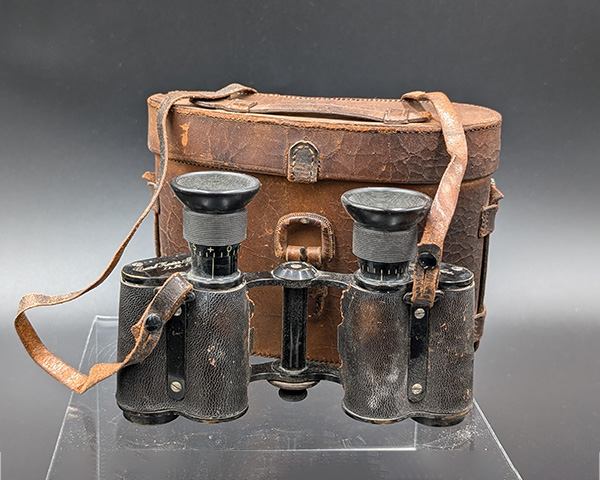 Side view of the Carl Zeiss Jena binoculars and case.