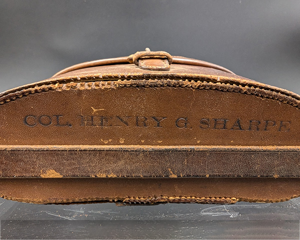 Bottom of the binoculars case with COL Henry G. Sharpe engraved.