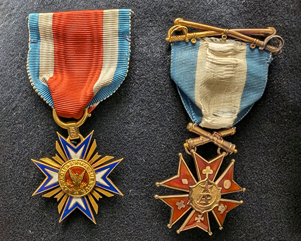 Two medals displayed, The Military Order of the Loyal Legion of the United States and The Society of the Army of the Potomac.