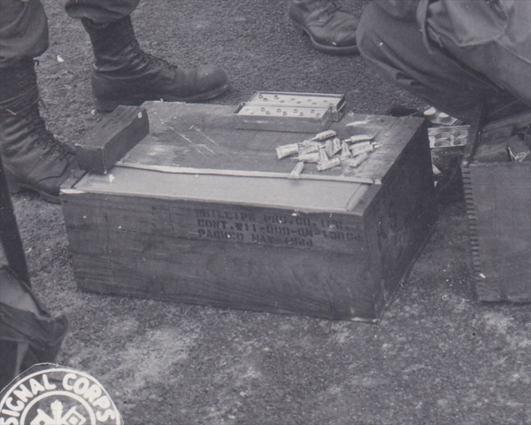 Ration crate detail: part of the top lid has been pried open to reveal the waxed liner.