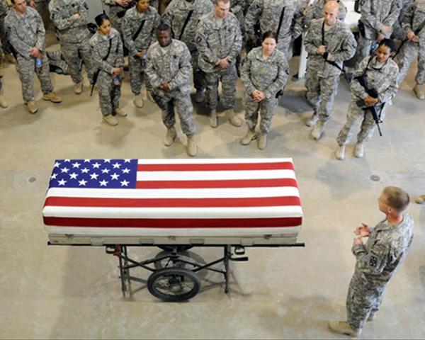 A transfer case, sitting on a mobile table covered with the U.S. flag.