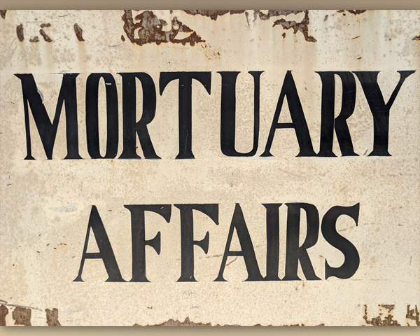 Closer image of the text from the Mortuary Affairs sign.