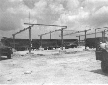 Victory Base facilities incorporated girders, first with tarpaulins on top and eventually roofing materials.