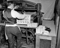 Man operates the zigzag machine.