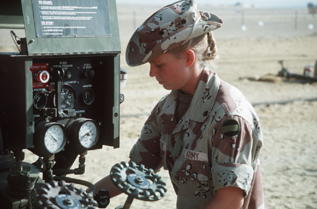 Soldier operating a water purification unit.