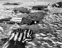 Recovered remains covered by US Flags.