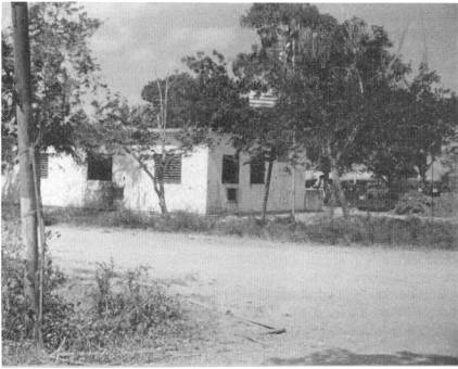 The Jilib Billeting building with several trees on the side.